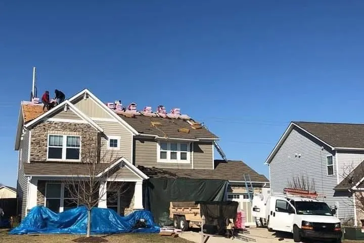 All-American Restoration crew mid tear-off on a Central Indiana two-story